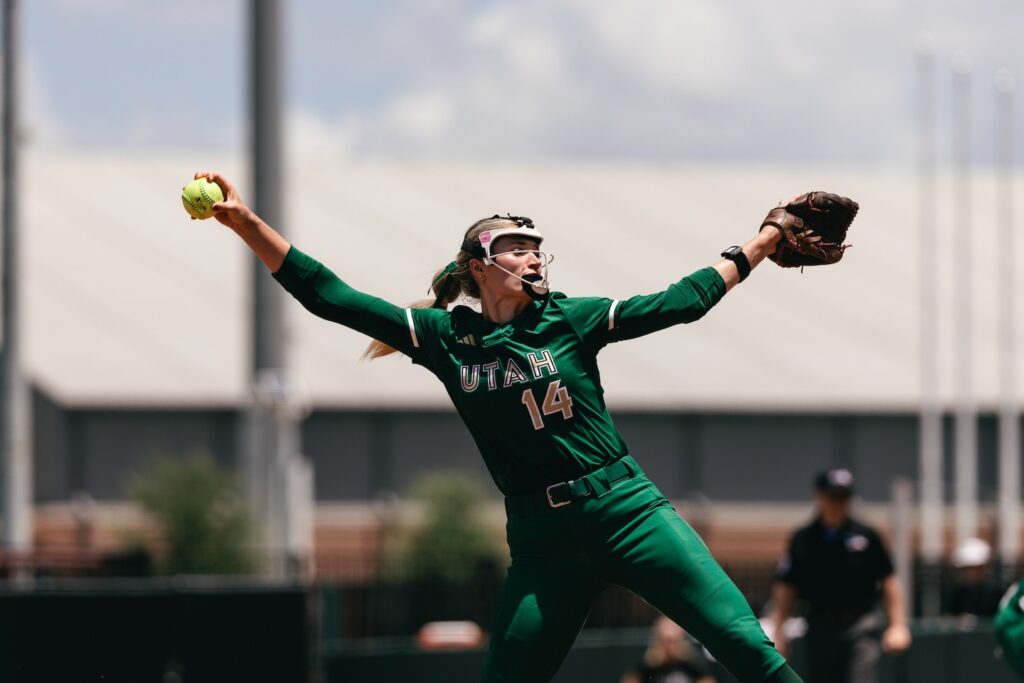 Montana Fouts in her pitching motion while competing in a green Utah Talons jersey.