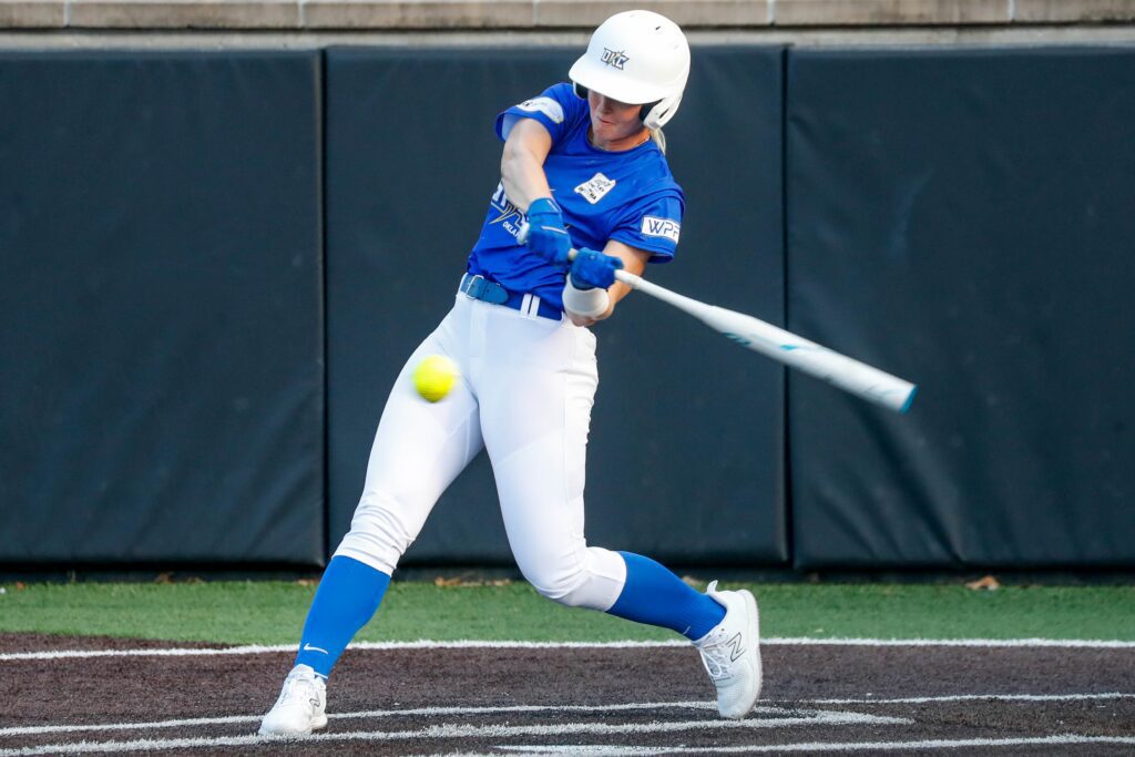 Oklahoma City Spark's Sydney Sherrill (24) hits a double and an RBI during a Women's Professional Fastpitch softball league game between the Oklahoma City Spark and the USSSA Pride.
