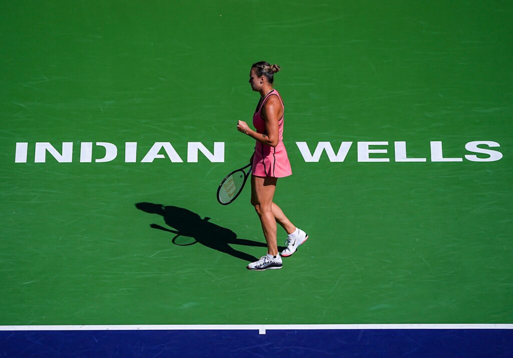 Aryna Sabalenka reacts to winning the second game against Elena Rybakina to tie 1-1 in the first set of the women’s singles championship final at the BNP Paribas Open in Indian Wells.