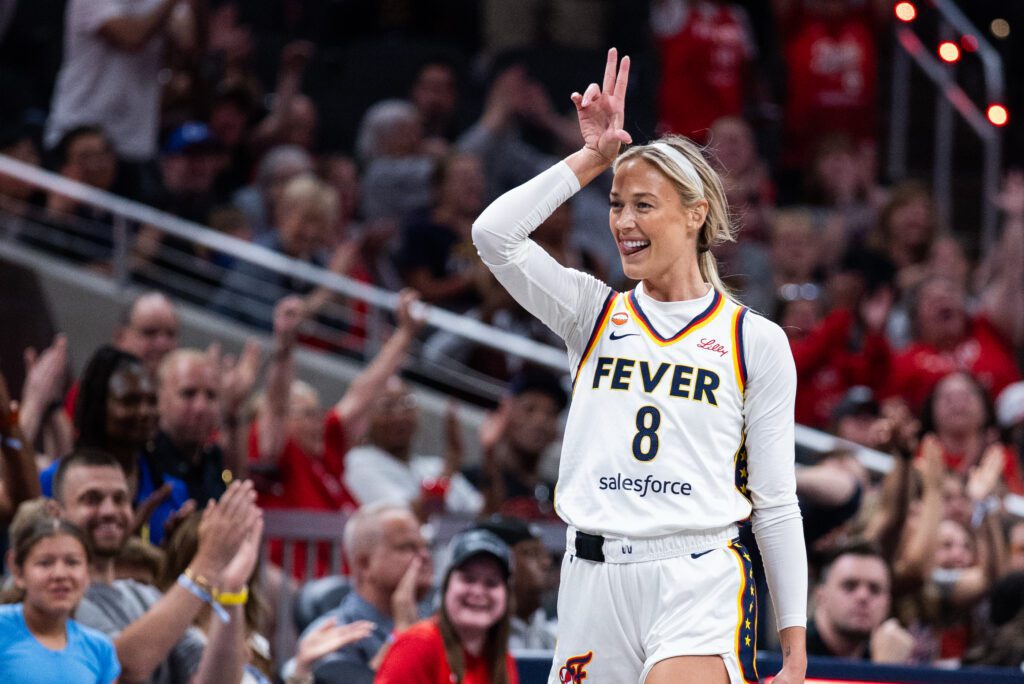 Indiana Fever guard Sophie Cunningham (8) celebrates a made shot in the first half against the Toronto Tempo at Gainbridge Fieldhouse.