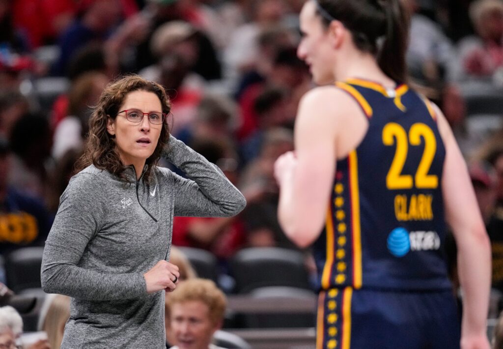 Indiana Fever head coach Stephanie White looks on to Indiana Fever guard Caitlin Clark (22).