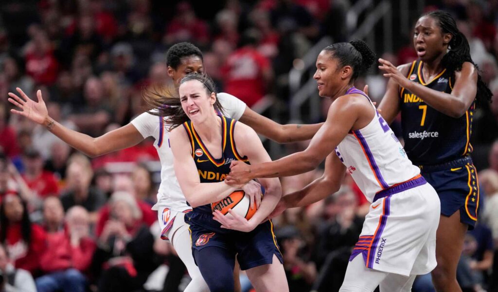 Phoenix Mercury forward Alyssa Thomas (25) attempts to strip the ball from Indiana Fever guard Caitlin Clark (22) on Monday, June 22, 2026, during the game at Gainbridge Fieldhouse in Indianapolis. The Indiana Fever defeated the Phoenix Mercury, 86-77.