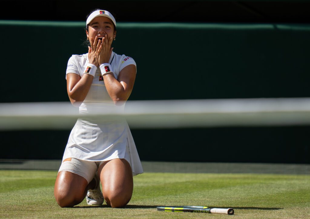 Alexandra Eala of the Philippines celebrates winning her match against Iga Swiatek of Poland on day six at All England Lawn Tennis and Croquet Club