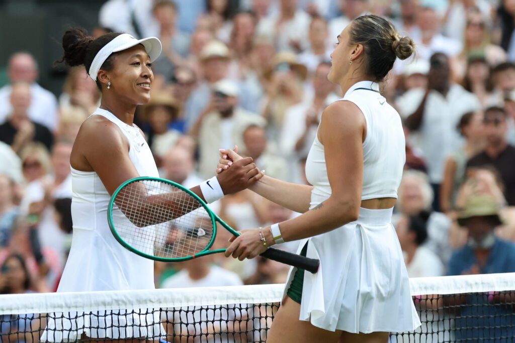Naomi Osaka (JPN) (L) shakes hands with Aryna Sabalenka (R) at the net after their match on day seven of The Championships Wimbledon 2026 at All England Lawn.