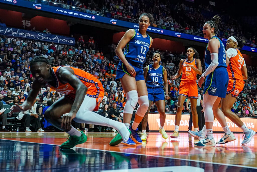 Connecticut Sun guard Saniya Rivers (22) is injured on s play against Minnesota Lynx forward Nia Coffey (12) in the first half at Mohegan Sun Arena.