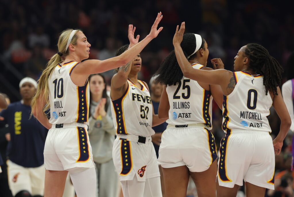 Indiana Fever guard Lexie Hull (10) celebrates with teammate Kelsey Mitchell (0) against the Phoenix Mercury in the first half at Mortgage Matchup Center.