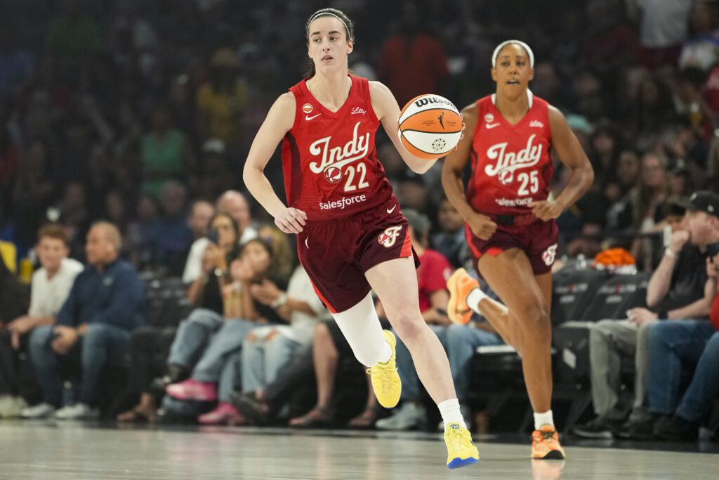 Indiana Fever guard Caitlin Clark (22) dribbles the ball during the first quarter of a WNBA basketball game against the Las Vegas Aces at Michelob Ultra Arena.