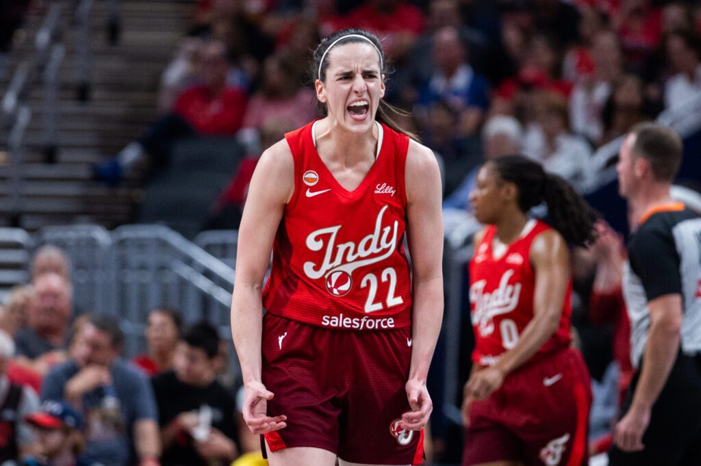 Indiana Fever guard Caitlin Clark (22) reacts against the Seattle Storm during the first half at Gainbridge Fieldhouse.