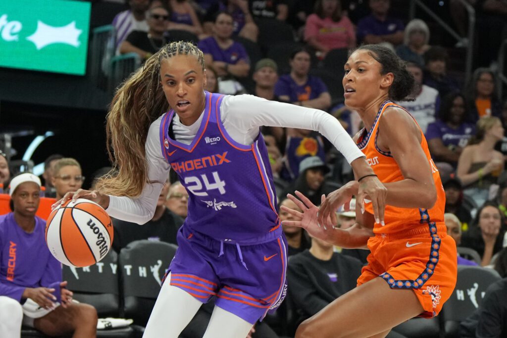 Phoenix Mercury forward-guard DeWanna Bonner (24) drives against Connecticut Sun center Olivia Nelson-Ododa (10) in the first half at Mortgage Matchup Center.