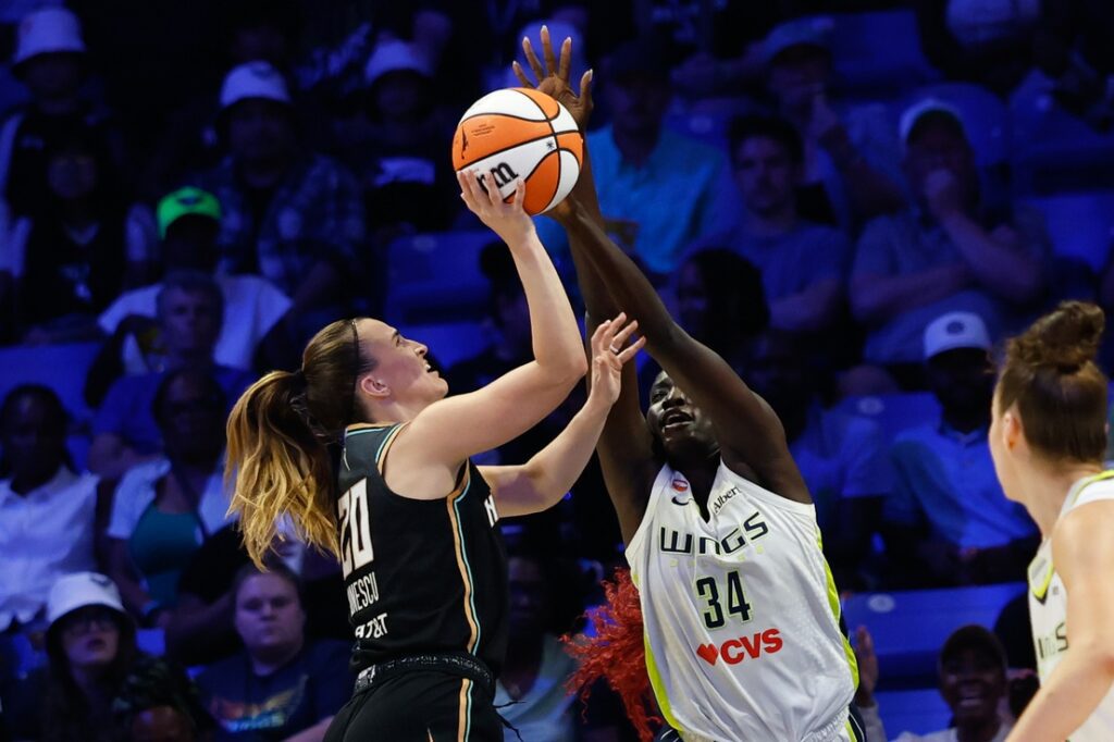 New York Liberty guard Sabrina Ionescu (20) has her shot blocked by Dallas Wings forward Awak Kuier (34) during the second half of Monday's Liberty vs Wings clash at College Park Center.