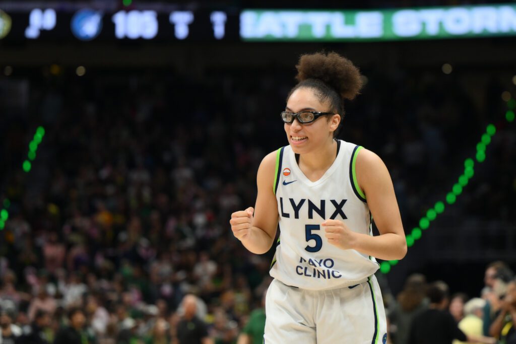 Minnesota Lynx guard Olivia Miles (5) celebrates defeating the Seattle Storm at Climate Pledge Arena.