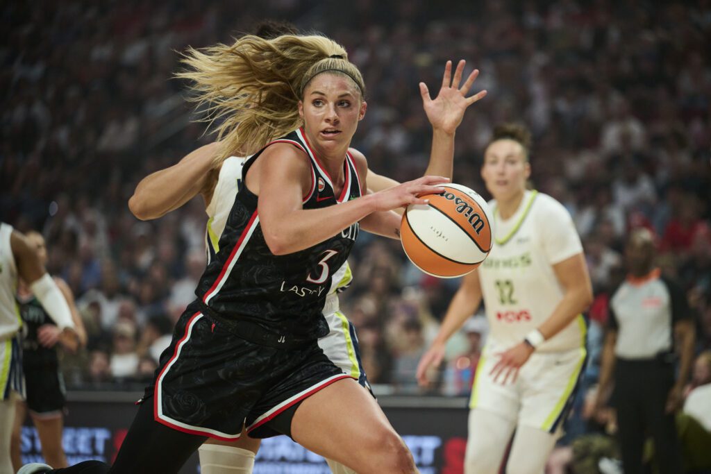 Portland Fire guard Sarah Ashlee Barker (3) drives to the basket during the first half against the Dallas Wings at Moda Center.