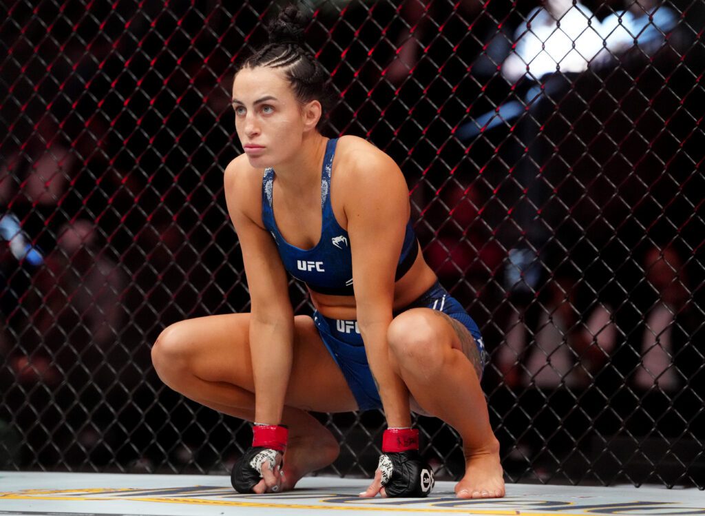 Casey O’Neill (red gloves) during UFC 296 at T-Mobile Arena.