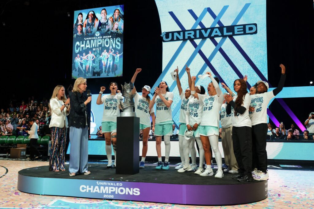 Mist basketball players celebrate after winning the Unrivaled championship game against the Phantom at Sephora Arena.