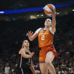 Connecticut Sun guard Hailey Van Lith (2) scores a basket during the first half against Portland Fire guard Sarah Ashlee Barker (3) at Moda Center.