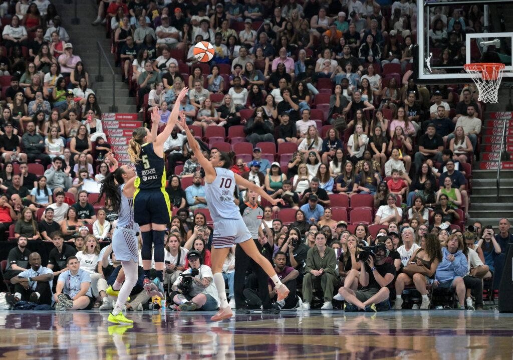 Dallas Wings guard Paige Bueckers (5) shoots a three pointer against the Toronto Tempo in the second half at the Bell Centre.