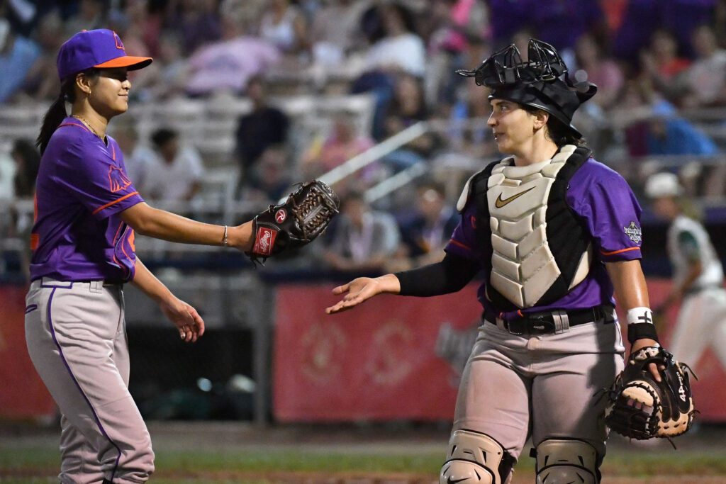 San Francisco Firebells pitcher Niki Eckert (22) and catcher Alexia Jorge (26) during a WPBL game with the Boston Hunters at Robin Roberts Stadium.