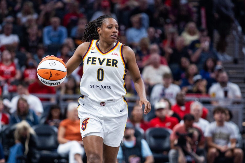 Indiana Fever guard Kelsey Mitchell (0) dribbles the ball in the second half against the New York Liberty at Gainbridge Fieldhouse.