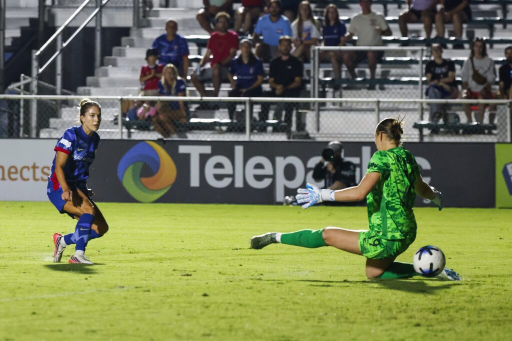 North Carolina Courage midfielder Ashley Sanchez (2) scores a goal past Angel City FC goalkeeper Angelina Anderson (19) during the second half at First Horizon Stadium at WakeMed Soccer Park.