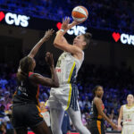 Dallas Wings forward Jessica Shepard (32) shoots over Connecticut Sun forward Diamond Miller (1) during the third quarter at College Park Center.