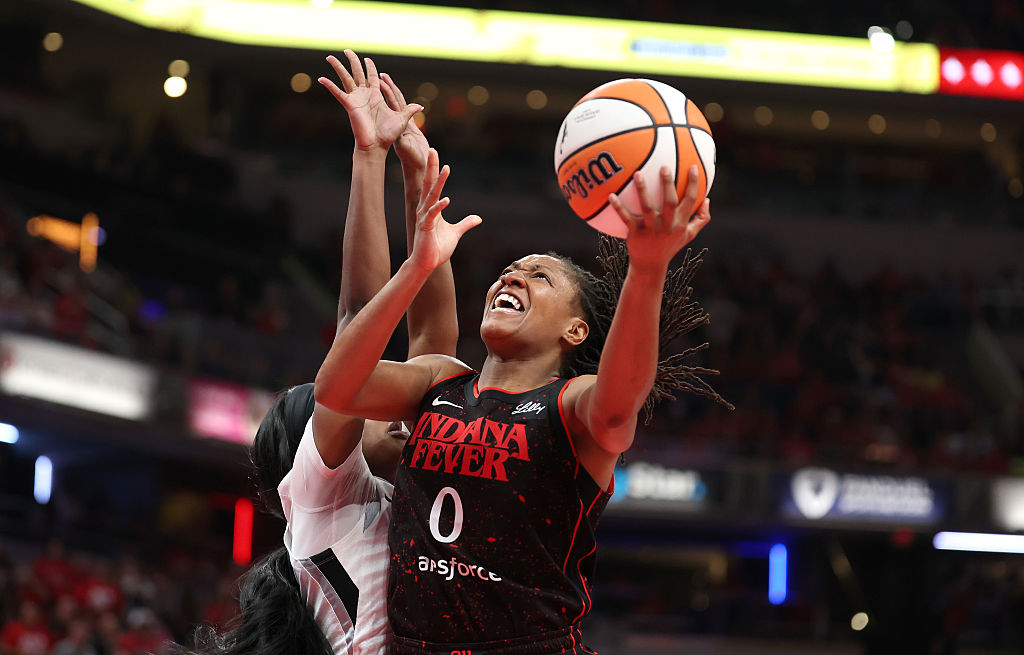Kelsey Mitchell #0 of the Indiana Fever shoots the ball during the game against the Las Vegas Aces in Game Three of the semifinals of the 2025 WNBA Playoffs at Gainbridge Fieldhouse on September 26, 2025 in Indianapolis, Indiana.
