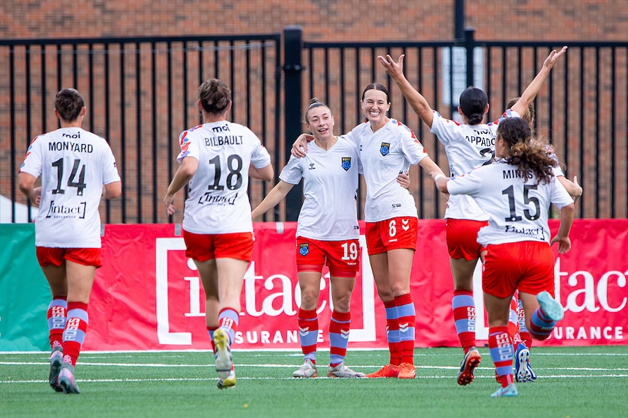 In Toronto, Ontario, Canada, on October 19, 2025, Montreal midfielder Allie Hess #6 celebrates her goal with Lorie Thibault #19 and the rest of the team during the Northern Super League game.