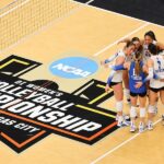 The Kentucky Wildcats huddle together during a break in the game against the Wisconsin Badgers during the Division I Women's Volleyball Championship Semifinals.