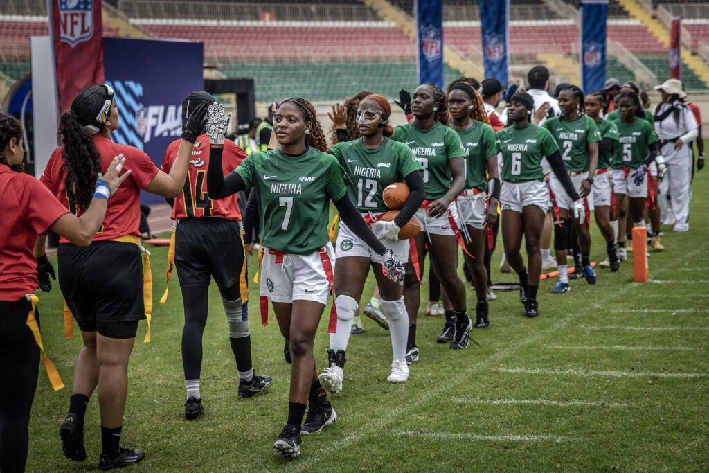 Players of Nigeria's national women's senior flag football team shake hands with Egypt's players after their game during the NFL Flag Africa Continental Championships at Nyayo Stadium in Nairobi on July 10, 2026.