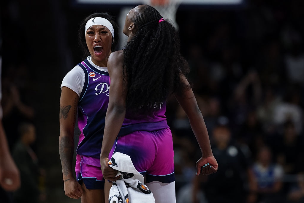 Cotie McMahon #23 and Michaela Onyenwere #12 of the Washington Mystics celebrate after a play against the Dallas Wings during the second half of the game at CareFirst Arena on August 5, 2026 in Washington, DC.