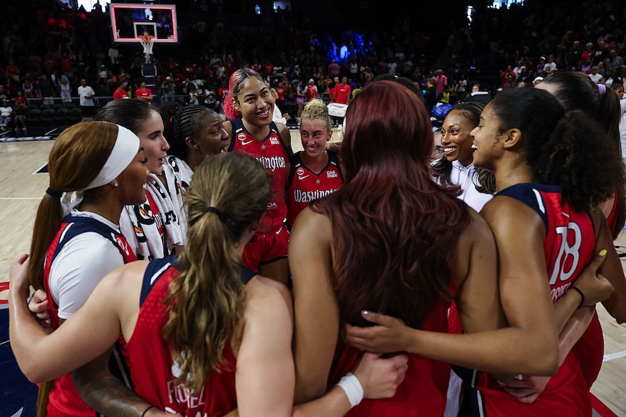Shakira Austin #0 of the Washington Mystics huddles with teammates after the game against the Phoenix Mercury at CareFirst Arena on August 9, 2026 in Washington, DC.