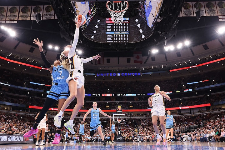 Sophie Cunningham #8 of the Indiana Fever is fouled by DiJonai Carrington #7 of the Chicago Sky during the first half at United Center on August 08, 2026.