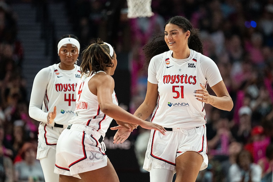 Lauren Betts #51 of the Washington Mystics reacts after a timeout is called during the first half of the game against the Portland Fire at Moda Center on August 23, 2026.