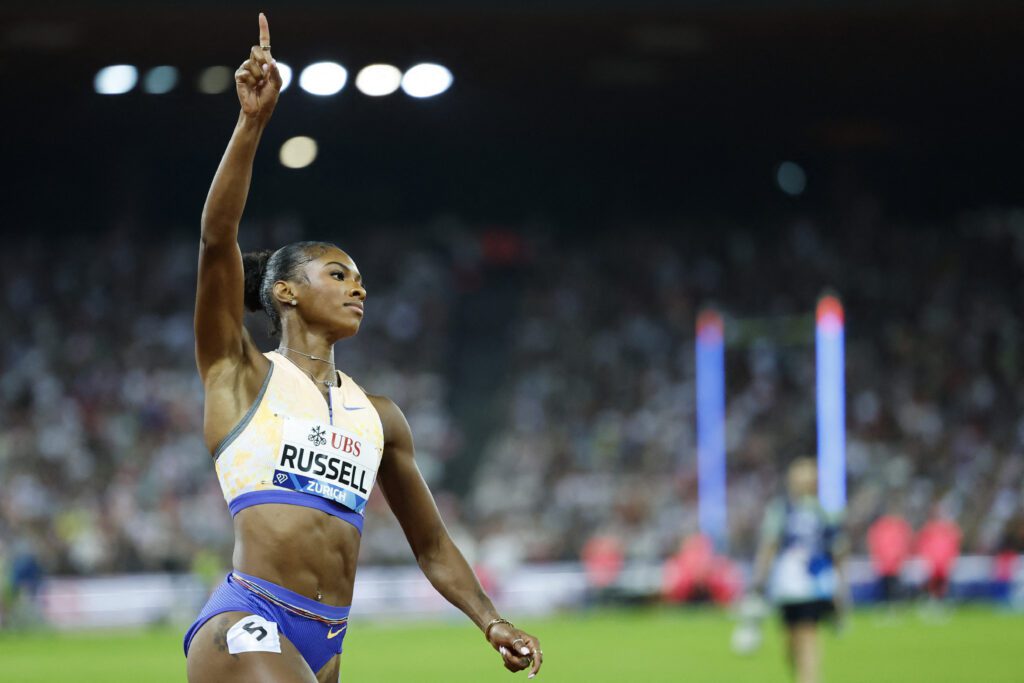Masai Russell celebrates as she crosses the finish line to win the women's 100m hurdles and breaks the world record during the IAAF Diamond League athletics meeting, at the Letzigrund Stadium, in Zurich.