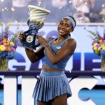 Coco Gauff of the United States celebrates with the Rookwood Cup after defeating Jessica Pegula of the United Staes during the Women's Final.