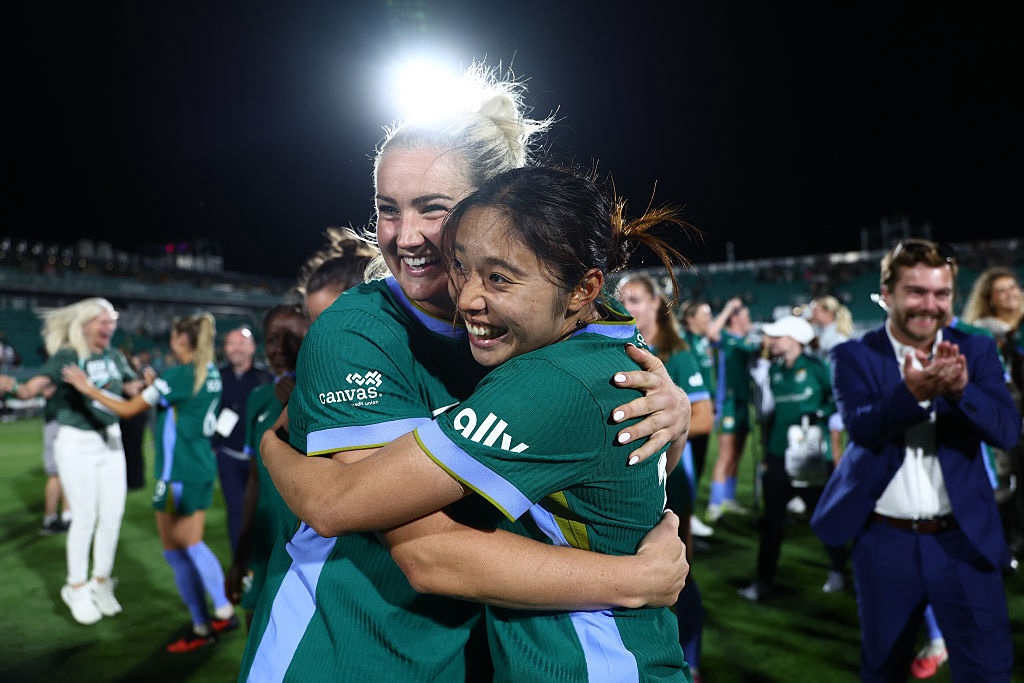 Yuzuki Yamamoto #18 of Denver Summit FC celebrates with teammate Lindsey Heaps #10 after winning the NWSL match between Denver Summit FC and Chicago Stars FC.