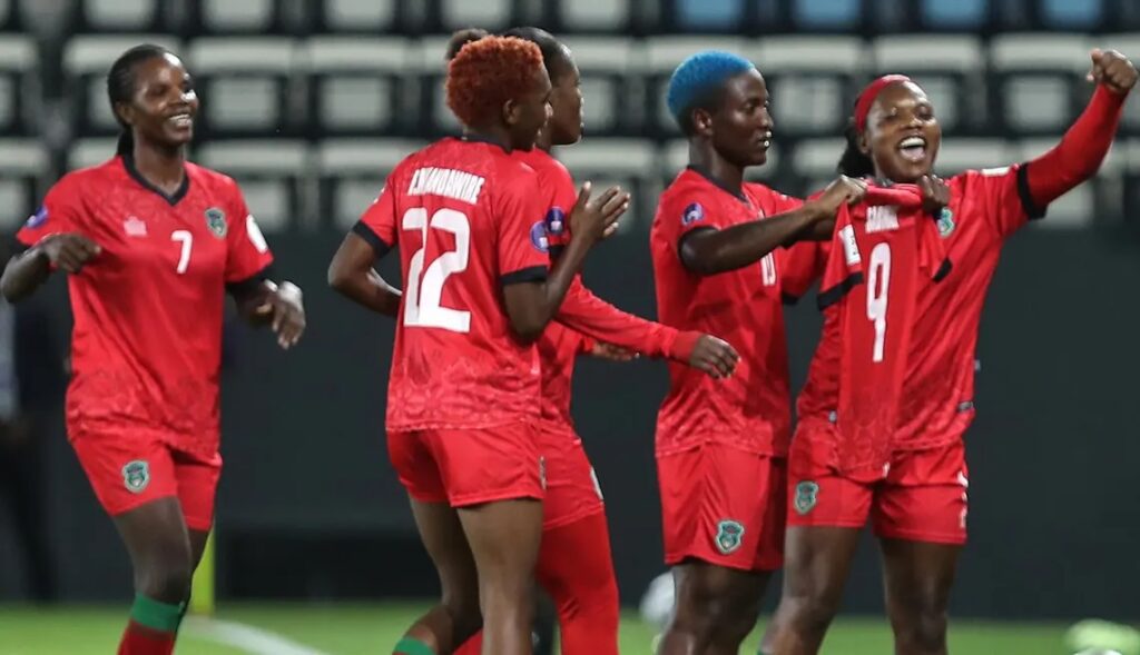 Temwa Chawinga celebrates a goal with her Malawi teammates during their WAFCON quarterfinal game.