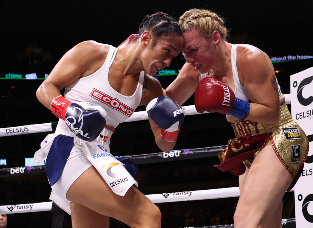 Amanda Serrano (left) fights against Heather Hardy in a boxing match at American Airlines Center.