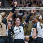 Purdue Junior Kenna Wollard (4) and her squad celebrate the win after the NCAA volleyball match between the Washington Huskies at the Purdue Boilermakers.