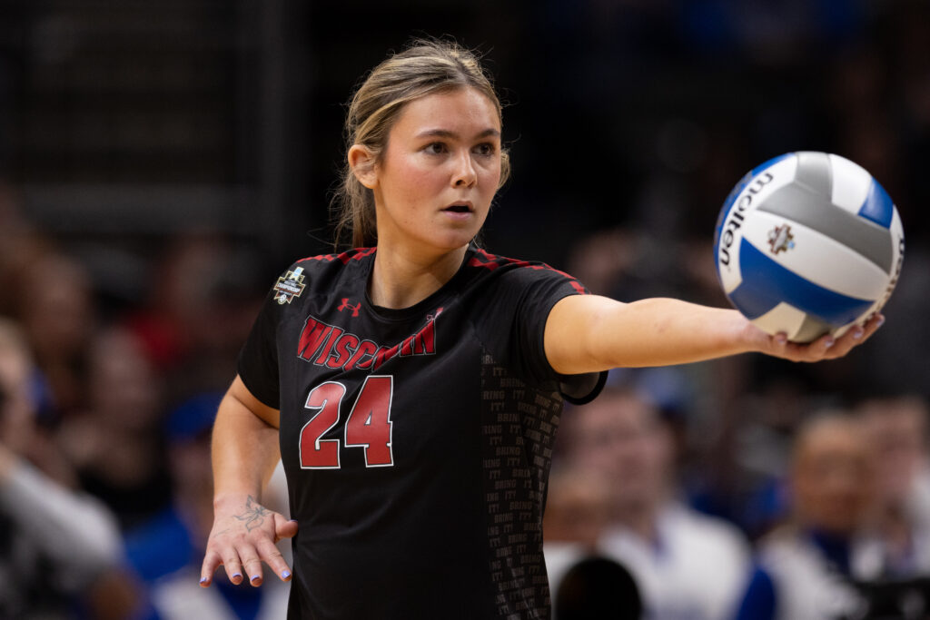 Wisconsin Badgers setter Charlie Fuerbringer (24) prepares to serve the ball in a 2025 NCAA Women’s Volleyball Championship semifinal match at T-Mobile Center.