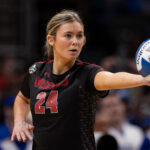 Wisconsin Badgers setter Charlie Fuerbringer (24) prepares to serve the ball in a 2025 NCAA Women’s Volleyball Championship semifinal match at T-Mobile Center.