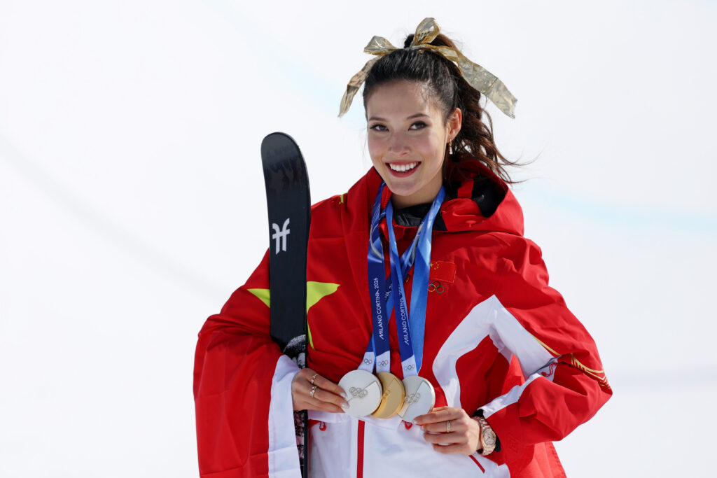 Gold medalist Ailing Eileen Gu of the People's Republic of China poses for a photo with her three medals after the medal ceremony for the women's skiing halfpipe during the Milano Cortina 2026 Olympic Winter Games at Livigno Snow Park.