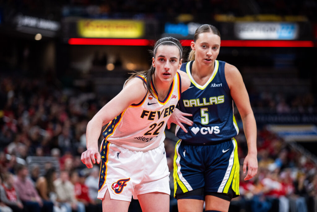 Indiana Fever guard Caitlin Clark (22) and Dallas Wings guard Paige Bueckers (5) during an inbounds play in the first half at the Gainbridge Fieldhouse.