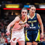 Indiana Fever guard Caitlin Clark (22) and Dallas Wings guard Paige Bueckers (5) during an inbounds play in the first half at the Gainbridge Fieldhouse.