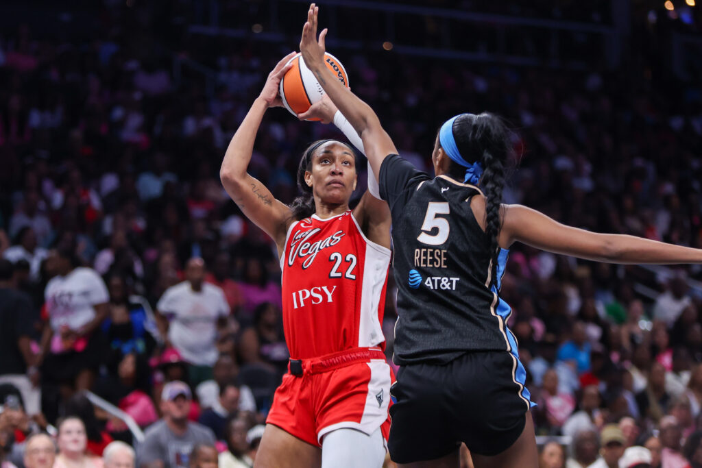 Las Vegas Aces center A'ja Wilson (22) shoots past Atlanta Dream forward Angel Reese (5) in the second quarter at State Farm Arena.