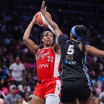 Las Vegas Aces center A'ja Wilson (22) shoots past Atlanta Dream forward Angel Reese (5) in the second quarter at State Farm Arena.