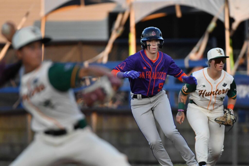 San Francisco Firebells infielder Amanda Gianelloni (5) leads off first base during a WPBL game with the Boston Hunters at Robin Roberts Stadium.