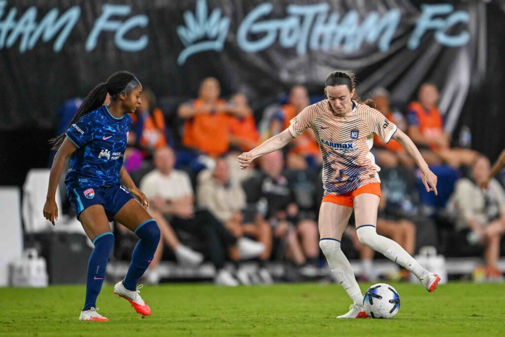Gotham FC midfielder Rose Lavelle (16) dribbles the ball chased by San Diego Wave FC midfielder Laurina Fazer (18) during the second half at Sports Illustrated Stadium.
