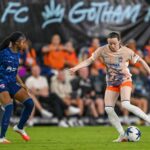 Gotham FC midfielder Rose Lavelle (16) dribbles the ball chased by San Diego Wave FC midfielder Laurina Fazer (18) during the second half at Sports Illustrated Stadium.