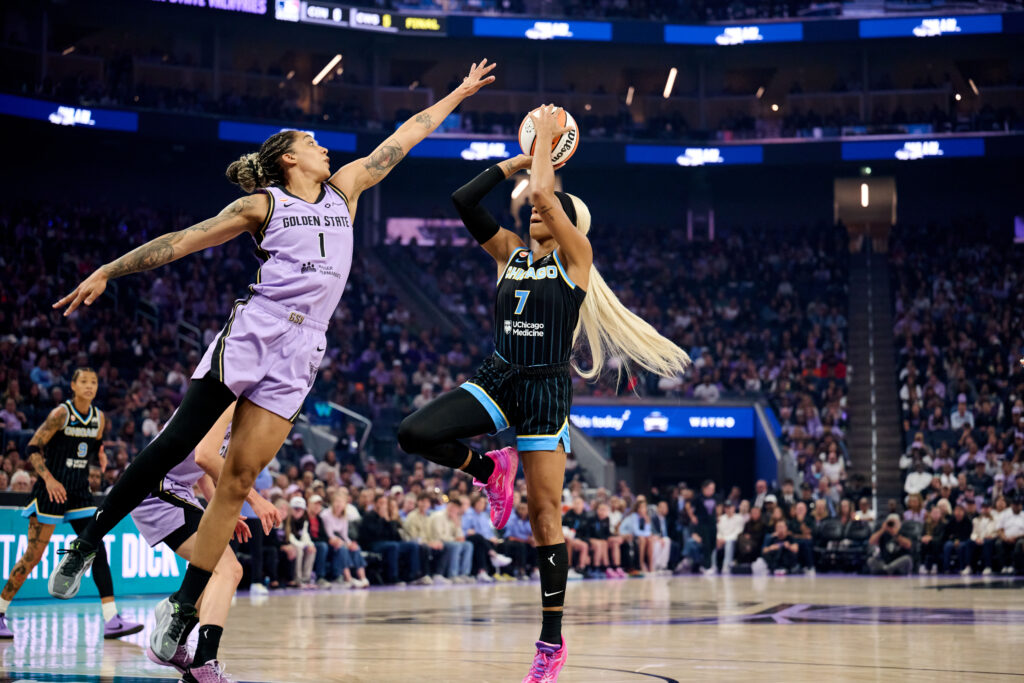 Chicago Sky guard DiJonai Carrington (7) shoots the ball against Golden State Valkyries forward Gabby Williams (1) during the first quarter at Chase Center.