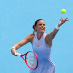 Maria Sakkari (GRE) serves against Iga Swiatek (POL) during the WTA Cincinnati Open at Lindner Family Tennis Center.